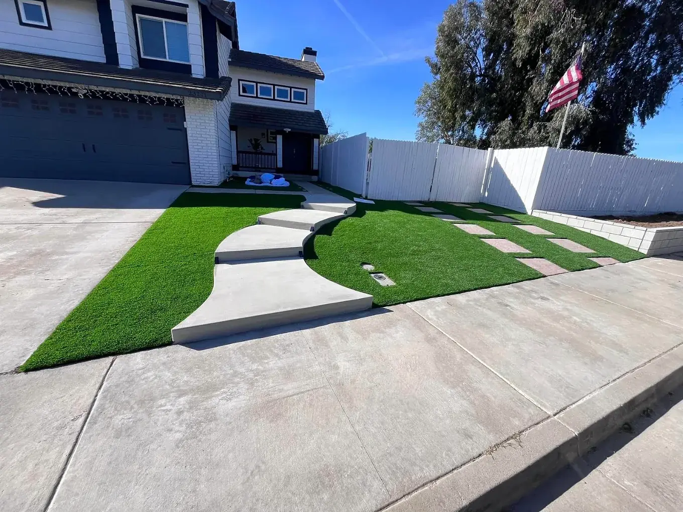Custom concrete entry and artificial turf